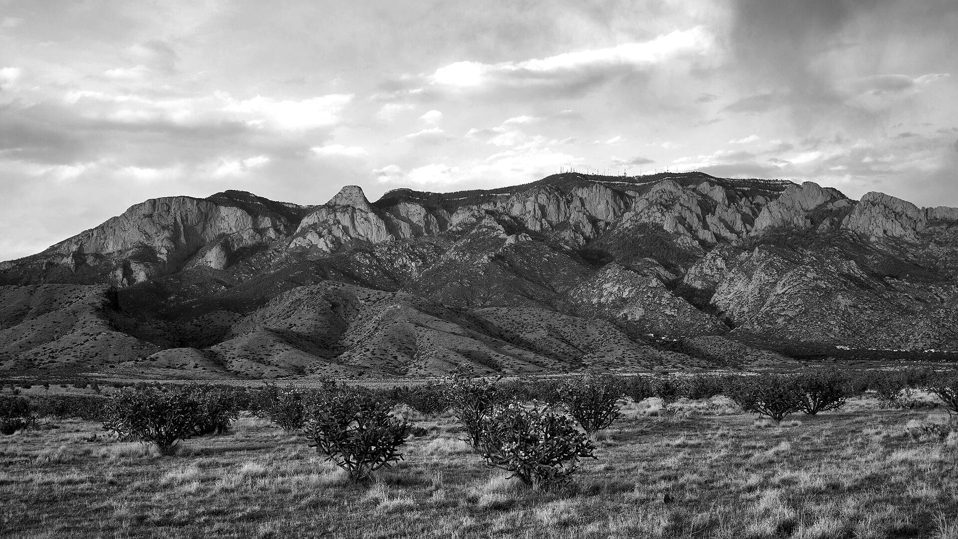 The Sandia Mountains above Albuquerque under a cloudy sky